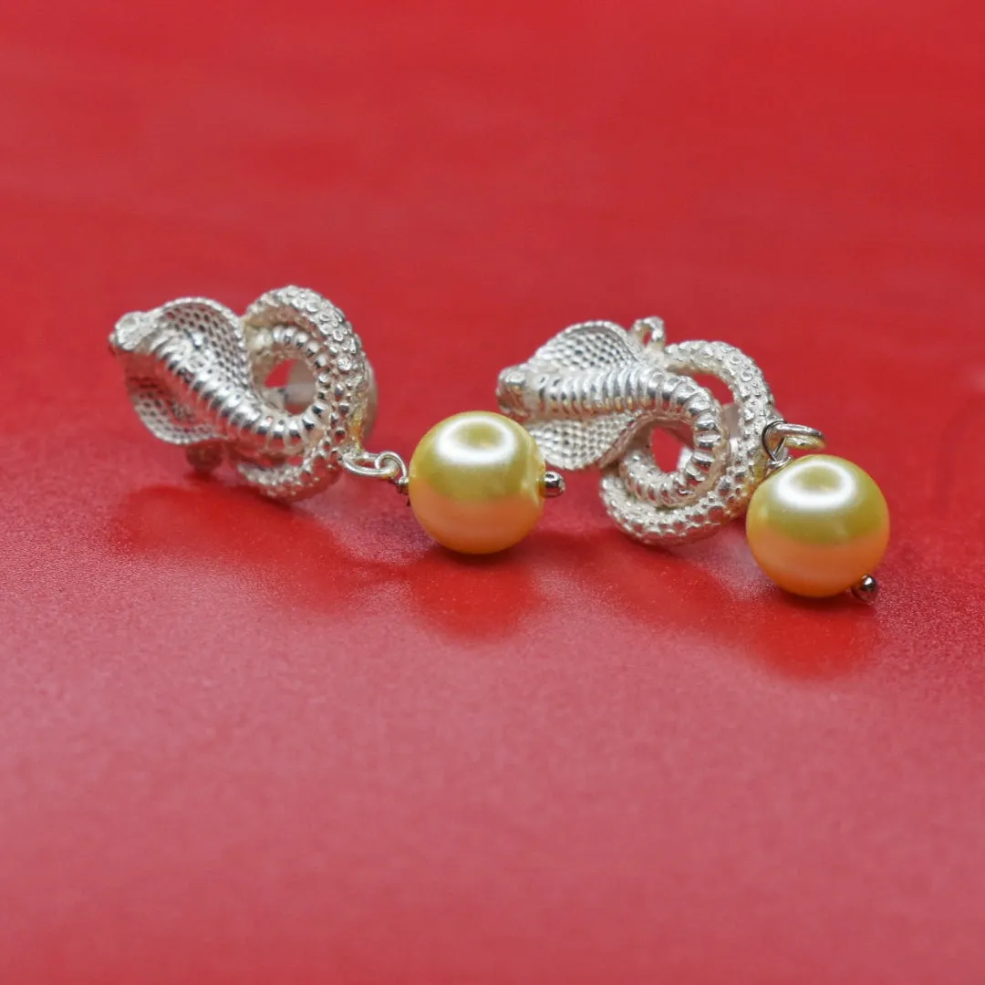 "Sleek and Stylish: Embrace Your Wild Side with Silver Snake Earrings"